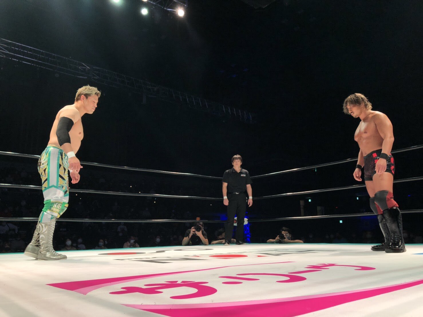 Shiozaki and Nakajima, facing each other across the ring at the Yokahama Budokan